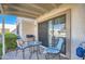 Relaxing covered patio with seating area, BBQ, and sliding glass door at 18624 N 92Nd Dr, Peoria, AZ 85382