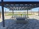 A shaded pergola area offers a nice place to gather with friends at 18743 N Avelino Dr, Maricopa, AZ 85138