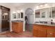 Bathroom featuring double sinks, wooden cabinets, and a walk-in shower at 19214 N 31St Dr, Phoenix, AZ 85027