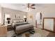 Serene bedroom with neutral tones, a ceiling fan, and stylish furnishings at 19214 N 31St Dr, Phoenix, AZ 85027