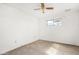 Bedroom featuring white walls, single window, and ceiling fan at 200 E Rose Ln, Avondale, AZ 85323