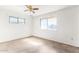 Bedroom with white walls, a ceiling fan, and a window at 200 E Rose Ln, Avondale, AZ 85323