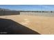 Spacious dirt backyard with a block fence and mountain views at 20328 N 225Th Dr, Surprise, AZ 85387