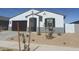 Well-maintained single-story home featuring desert landscaping at 20328 N 225Th Dr, Surprise, AZ 85387