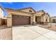 Single-story home featuring a two-car garage and a well-maintained front yard at 20931 E Via Del Sol St, Queen Creek, AZ 85142