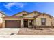 Inviting single-story home showcasing a well-manicured lawn and charming architectural details at 20931 E Via Del Sol St, Queen Creek, AZ 85142