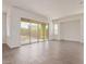 Bright living room featuring sliding glass doors and stylish tile flooring at 20931 E Via Del Sol St, Queen Creek, AZ 85142