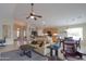 Open concept living room showcases the seamless flow between the living, kitchen, and dining areas at 2477 E Valencia Dr, Casa Grande, AZ 85194