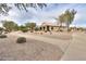 Sidewalk view of home and desert landscaping at 2477 E Valencia Dr, Casa Grande, AZ 85194