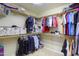 Spacious walk-in closet with ample shelving and hanging space for clothing and accessories at 2477 E Valencia Dr, Casa Grande, AZ 85194