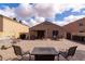 Spacious backyard with a patio, comfortable seating, and a built-in spa at 24816 N Good Pasture Ln, Florence, AZ 85132