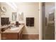 Well-lit bathroom with a granite countertop, undermount sink, and glass-enclosed shower stall at 24816 N Good Pasture Ln, Florence, AZ 85132