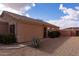 Back exterior view of a home with desert landscaping and a privacy fence at 24816 N Good Pasture Ln, Florence, AZ 85132