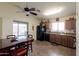 Eat-in kitchen with dining table, wooden cabinets, and sliding glass doors to the backyard patio at 24816 N Good Pasture Ln, Florence, AZ 85132