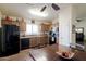 Bright eat-in kitchen featuring wood cabinets and black appliances, offering a cozy dining experience at 24816 N Good Pasture Ln, Florence, AZ 85132