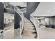 Grand foyer with a winding staircase, dark accent walls, and views to the formal rooms at 2535 E Saratoga St, Gilbert, AZ 85296