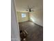 Bedroom featuring modern flooring, neutral walls, and a ceiling fan at 2540 E Hartford Ave, Phoenix, AZ 85032