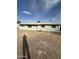 View of home's exterior showcasing its single-story design and low maintenance landscaping under a bright sky at 2540 E Hartford Ave, Phoenix, AZ 85032