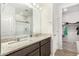 Bathroom features double sink vanity, walk-in closet, and a glass door shower at 2622 E Monument Canyon Ave, Apache Junction, AZ 85119