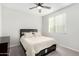 Bedroom features neutral tones, ceiling fan, carpeted floors, and natural light at 2622 E Monument Canyon Ave, Apache Junction, AZ 85119