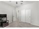 Neutral bedroom showcasing gray carpet, closet, and doors leading to other rooms at 2622 E Monument Canyon Ave, Apache Junction, AZ 85119