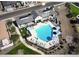 Aerial view of community pool featuring lounge chairs, sun umbrellas, and ample space for relaxation at 2622 E Monument Canyon Ave, Apache Junction, AZ 85119