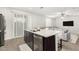 Kitchen with granite countertops, stainless steel appliances, dark cabinets, and wood-look tile flooring at 2622 E Monument Canyon Ave, Apache Junction, AZ 85119