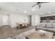 Open-concept living room and dining area with wood-look tile floors and neutral colors at 2622 E Monument Canyon Ave, Apache Junction, AZ 85119