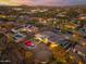 Aerial view of a private backyard with a pool in a serene desert neighborhood at dusk at 27606 N 61St Pl, Scottsdale, AZ 85266