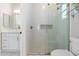 Modern bathroom with white subway tile, glass shower, and white vessel sink at 27606 N 61St Pl, Scottsdale, AZ 85266