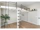 Bedroom featuring industrial loft and bright light from large windows at 27606 N 61St Pl, Scottsdale, AZ 85266