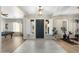 Grand foyer featuring a decorative light fixture and white shuttered windows at 27606 N 61St Pl, Scottsdale, AZ 85266