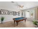 Spacious game room featuring a pool table and view of the pool at 27606 N 61St Pl, Scottsdale, AZ 85266