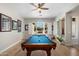 Game room with a pool table and natural light from the outdoor view at 27606 N 61St Pl, Scottsdale, AZ 85266