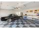 Spacious garage with classic car and built in work benches at 27606 N 61St Pl, Scottsdale, AZ 85266