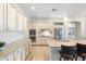 Bright kitchen featuring granite countertops, stainless steel appliances, and hardwood floors at 27606 N 61St Pl, Scottsdale, AZ 85266