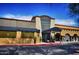 Exterior view of Mastro's Steakhouse featuring a contemporary stone and stucco facade at 27606 N 61St Pl, Scottsdale, AZ 85266