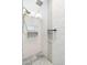 Elegant shower featuring white subway tile, a shower head, and gray accent tiles at 27606 N 61St Pl, Scottsdale, AZ 85266