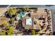 Overhead view of a stunning home with a pool and meticulously landscaped yard, offering an outdoor oasis at 27701 N Lucero Dr, Rio Verde, AZ 85263