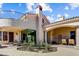 Exterior view of the backyard with patio area, rose bushes and seating at 27701 N Lucero Dr, Rio Verde, AZ 85263