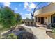 Backyard patio with outdoor bar area and manicured desert landscaping at 27701 N Lucero Dr, Rio Verde, AZ 85263