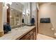 Bathroom vanity with tile countertops and dark wood cabinets at 27701 N Lucero Dr, Rio Verde, AZ 85263