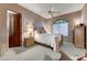 Bedroom with neutral color palette, bright natural light, and ceiling fan at 27701 N Lucero Dr, Rio Verde, AZ 85263