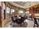 Cozy breakfast nook with ample natural light, custom window treatments and built in cabinetry with a wine refrigerator at 27701 N Lucero Dr, Rio Verde, AZ 85263