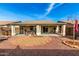 View of the covered patio in the backyard with a rock garden at 30124 N Sunray Dr, San Tan Valley, AZ 85143