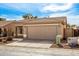 A neutral-colored single-story home with a two-car garage and desert landscaping at 30124 N Sunray Dr, San Tan Valley, AZ 85143