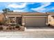 Charming single-story home features a desert landscape, a two-car garage, and a tile roof at 30124 N Sunray Dr, San Tan Valley, AZ 85143