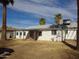 Backyard featuring sparse landscaping and the back of a white home under a blue sky at 3345 W Laurel Ln, Phoenix, AZ 85029