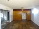 Bedroom with wood floors, a ceiling fan, closet, and natural light at 3345 W Laurel Ln, Phoenix, AZ 85029