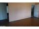 Empty room with hardwood flooring and peach colored walls at 3345 W Laurel Ln, Phoenix, AZ 85029